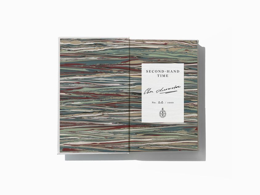 The marbled endpapers of Second-Hand Time by Svetlana Alexievich, translated by Bela Shayevich. The signed and numbered bookplate is also shown.